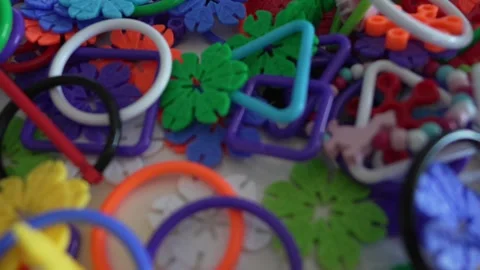 Close up on plastic stack of interlocking assembly DIY toys Stock Footage 247022174