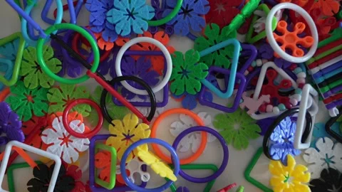 Close up on plastic stack of interlocking assembly DIY toys Stock Footage 247022179