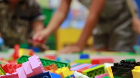 Close up plastic toy and blur kid playing in background.02 Video stock 90889872