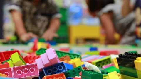 Close up plastic toy and blur kid playing in background. Stock Footage 90890572