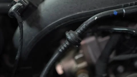 Close-up of a plastic vacuum line check valve under hood. Stock Footage 345709178
