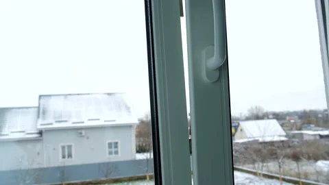 Close the plastic window with your hand. Selective focus. Stock Footage 224843930