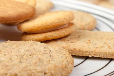 Close up of a plate of assorted fresh crisp biscuits Stock Photos