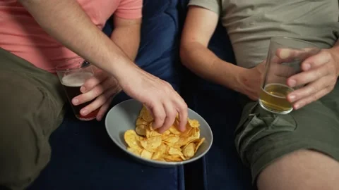 Close-up of plate of chips and beer in male hands. Stock Footage 218440301