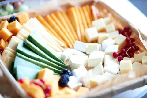 A close up on a plate different cheeses Stock Photos