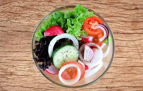 Close-up plate of fresh vegetables on the table Stock Photos
