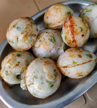 Close up of plate full of paddu. selective focus. 스톡 사진