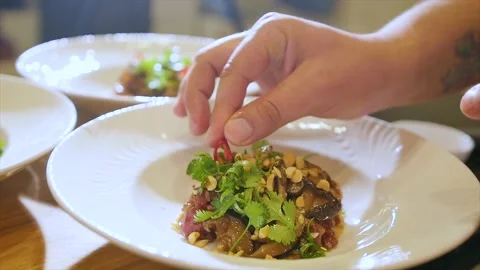 Close-up of a plate with a juicy dish of beef tartare. Tasting a delicious meal Stock Footage 194752178