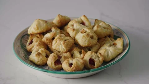 Close up plate of puff pastry appetizer, slow motion, 4K Stock Footage 229808896