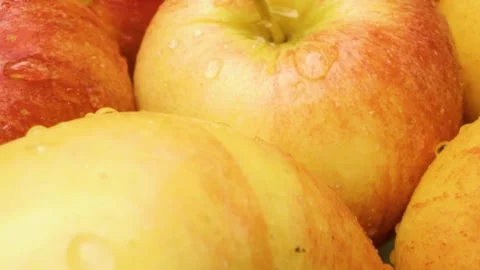 Close-up of a plate of red sweet apples captured with a sliding motion Stock Footage 313833257