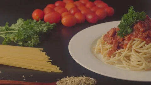 Close up on a plate of spaghetti served with minced beef and sausage sauce and i Stock Footage 108178451