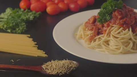 Close up on a plate of spaghetti served with minced beef and sausage sauce and i Stock Footage 108178465