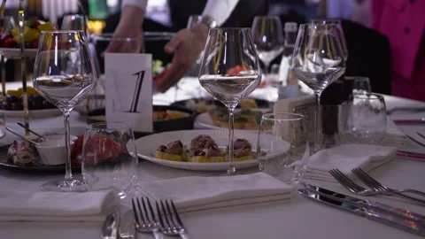 Close-up of plates and glasses on the table in a restaurant. Stock Footage 248146821