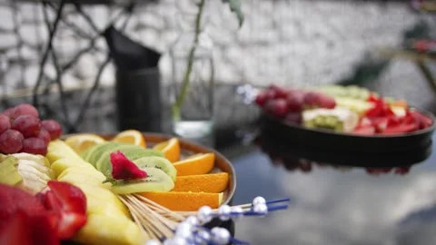 Close-up of plates with different types of fruit and berries on a buffet table Video stock 277059929