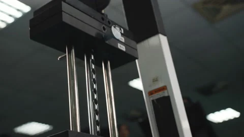 Close-up plates stacked of weight machine with kilogram and pound at fitness gym Stock Footage 106444002