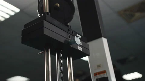 Close-up plates stacked of weight machine with kilogram and pound at fitness gym Video stock 111663923