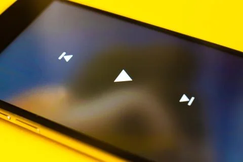 Close up play button interface on a modern gadget when watching videos Stock Photos