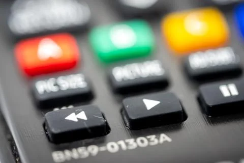 Close-up of the play button of a TV remote control Stock Photos