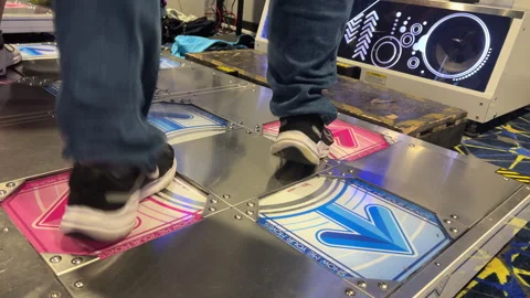 Close up of player feet on dancing rhythm arcade game 4k Видео 271200386