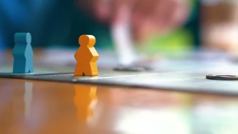 Close up player piece on tabletop board game on wooden table Stock Footage 116917784