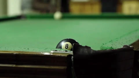Close up of a player sinking the black ball Stock Footage 254794356