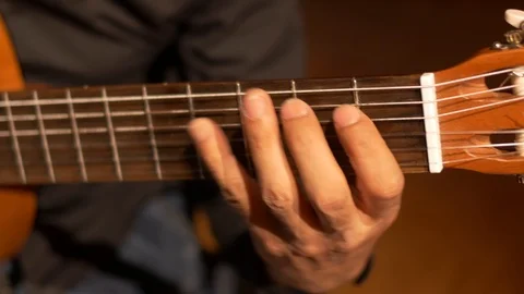 Close-up playing acoustic guitar Video stock 94864448