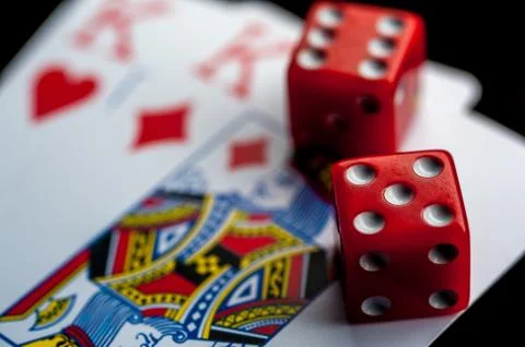 Close-up - Playing Cards And Red Gaming Dices Stock Photos