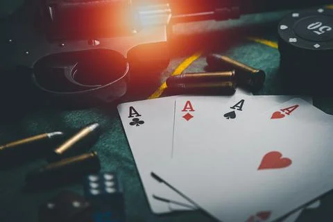 Close-up playing chips, playing cards, gun and bullets. casino poker game con Stock Photos