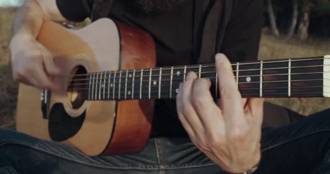 Close up playing at the guitar Stock Footage 134574097