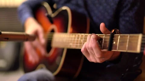 Close-up, playing the guitar, frame of hands playing the strings Vidéo 149616262