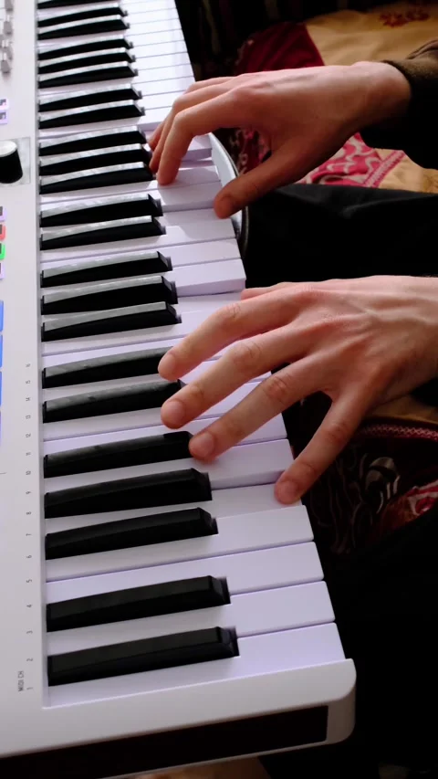 Close-Up Playing MIDI Keyboard Controller Melodies and Chords 库存影片 331909009