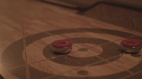  Close up playing shuffleboarding on a table in 4k. Stock Footage 88286193