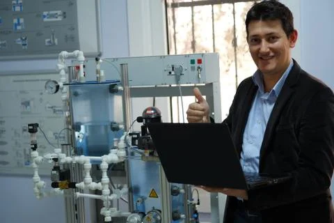 Close up of PLC programming Engineer's laptop and analog process automation k Stock Photos