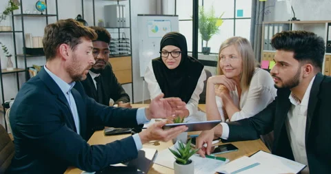 Close up of pleasant confident skilled hardworking multiracial team which Stock Footage 159618257