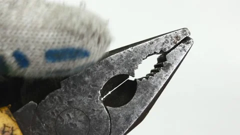 Close up of pliers. Man checks the operation of pliers on a white background. Stock Footage 143016035