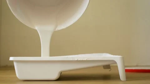 Close-up plot of pouring a viscous light substance from a can. Clip. Pouring Stock-Footage 139769013