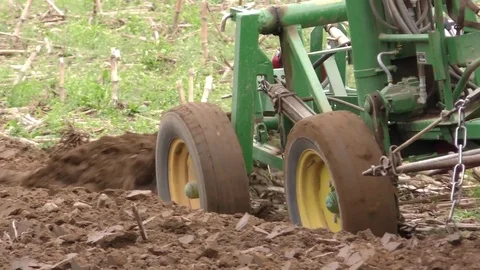 Close up of plow, Amish farmer preparing farm field for planting, Indiana USA Stock Footage 75610604