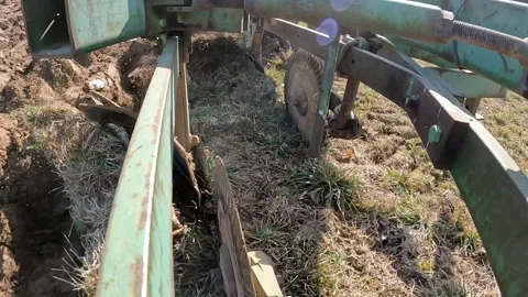 Close up  of plow as the soil is cut and turned; Farmer raises disc and Video stock 276808812