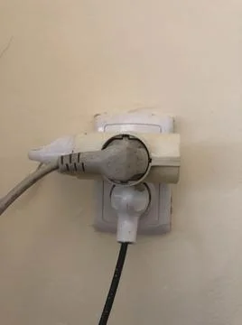 A close up of a plug with lots of cables plug in. Stock Photos