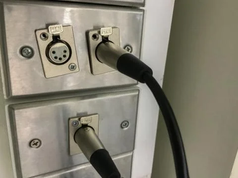 Close up of Plug xlr on the wall Stock Photos