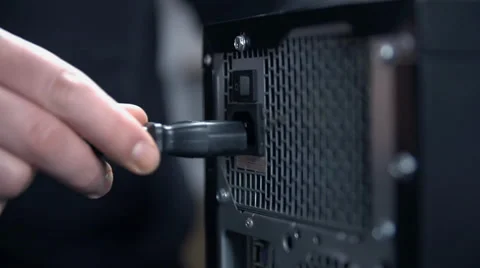 Close up plugging electric cable in to PC Video stock 39392117