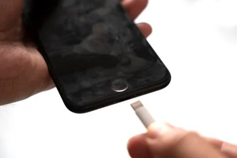 Close up of plugging phone charger Stock Photos