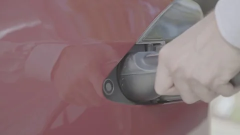 Close up of plugging in a Tesla Video stock 74696695
