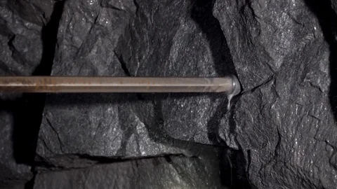 Close-up pneumatic drill. Workers in mine perforating the rock using a pneumatic Video stock 97161298