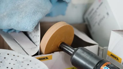 Close up of pneumatic sander with sanding discs and workshop tools Stock Footage 336388935