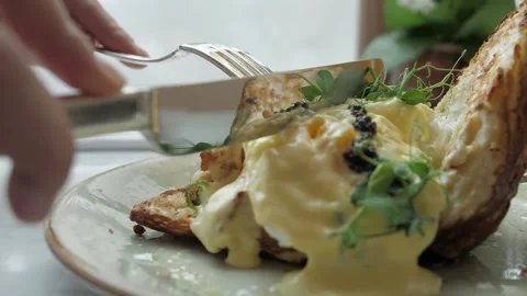 Close up of poached egg with black caviar Stock Footage 139685587