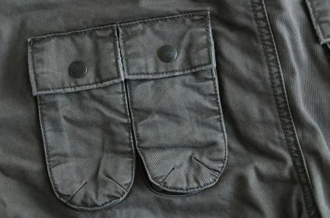 Close-up pockets of gray trousers. Work clothes. Stock Photos