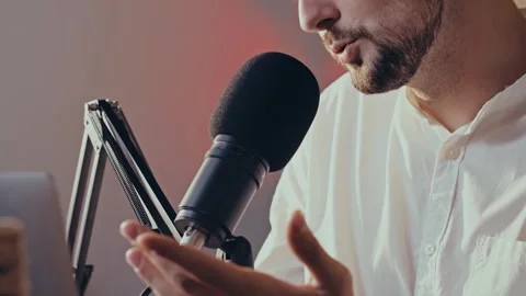Close up podcast process. Young bearded guy starts his new show in social Stock Footage 255306871