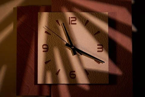 Close-up of pointer clock on wood grain stone texture surface Stock Photos