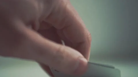 Close-up of poker cards, player checking his hand before making bet, slow motion Stock Footage 130905368